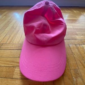 Pink running hat with pony tail hole. Band is stretchy. Never worn